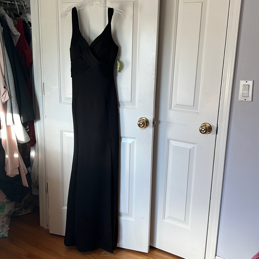 Windsor black long gown form fitting with high slit in a size small
